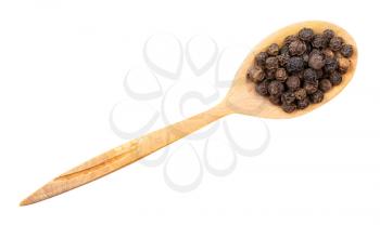 top view of hainan black pepper in wood spoon isolated on white backgrouns