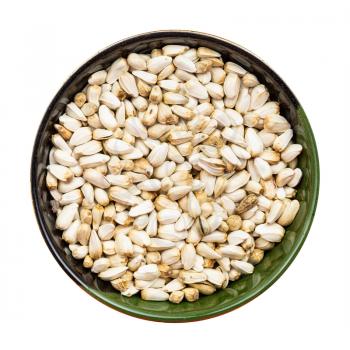 top view of safflower seeds in round bowl isolated on white background
