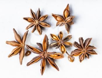 several dried star anise (badian) fruits close up on gray ceramic plate