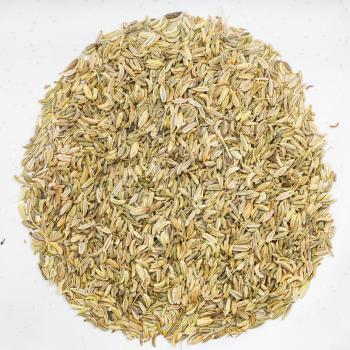 top view of pile of fennel seeds on gray ceramic plate