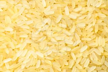 food background - raw parboiled long-grain rice