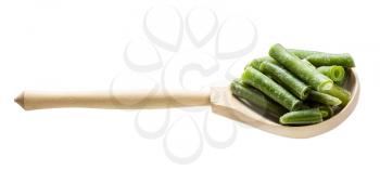cut and frozen green beans in wooden spoon isolated on white background