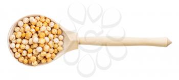 top view of wood spoon with dried whole yellow peas isolated on white background