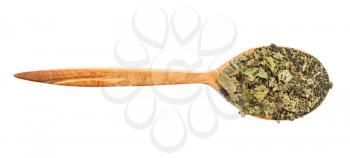top view of wood spoon with ground leaves of purple and green basil herb isolated on white background
