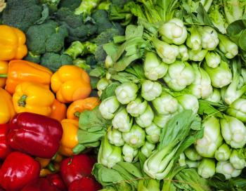 Vegetables in Asian market close up - Capsicum bell peppers, broccoli  cabbage, Green chinese cabbage