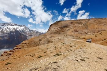 Road in mountains (Himalayas) with car. Spiti Valley,  Himachal Pradesh, India