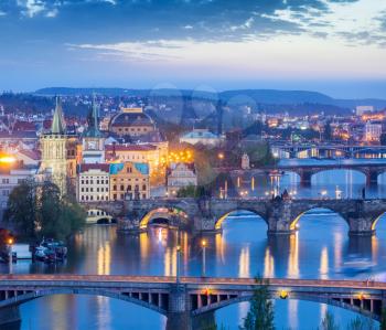 Travel Prague concept background - elevated view of bridges over Vltava river from Letna  Park. Prague, Czech Republic in twilight