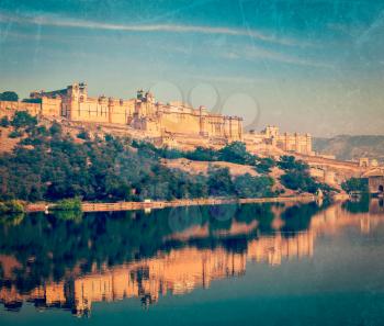 Vintage retro hipster style travel image of Famous Rajasthan landmark - Amer (Amber) fort, Rajasthan, India with grunge texture overlaid