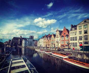 Vintage retro hipster style travel image of travel Belgium medieval european city town background with canal. Koperlei street, Ghent, Belgium