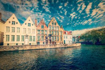 Vintage retro hipster style travel image of Bruges canals. Brugge, Belgium with grunge texture overlaid