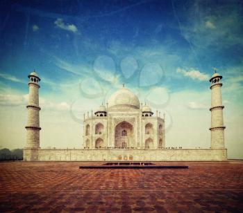 Vintage retro hipster style travel image of Taj Mahal. Indian Symbol - India travel background with grunge texture overlaid. Agra, India