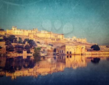 Vintage retro hipster style image of Famous Rajasthan landmark - Amer (Amber) fort, Rajasthan, India with grunge texture overlaid