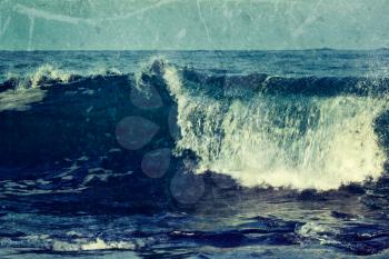 Vintage retro hipster style travel image of wave close up  in ocean with grunge texture overlaid. Sri Lanka