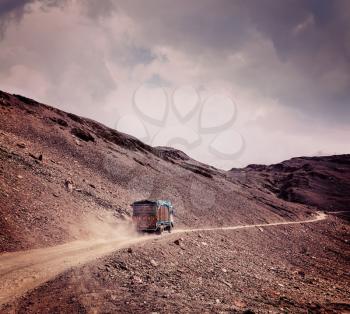 Vintage retro effect filtered hipster style travel image of Manali-Leh Road in Indian Himalayas with lorry. Himachal Pradesh, India