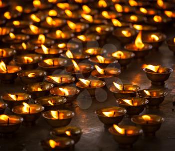 Burning candles in Buddhist temple, McLeod Ganj India