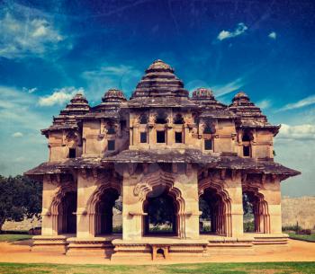 Vintage retro hipster style travel image of Lotus Mahal ruins with overlaid grunge texture. Royal Centre. Hampi, Karnataka, India