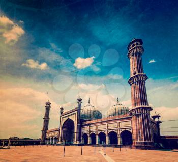 Vintage retro hipster style travel image of Jama Masjid - largest muslim mosque in India with grunge texture overlaid. Delhi, India