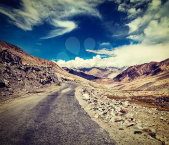 Vintage retro effect filtered hipster style travel image of Scenic road in Himalayas near Khardung-La pass. Ladakh, India