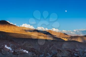 Basgo Gompa (Tibetan Buddhist monastery) and Himalayan landscape on sunset and moonrise. Ladakh, India