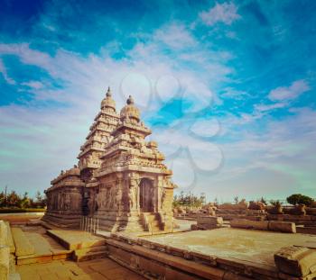 Vintage retro hipster style travel image of famous Tamil Nadu landmark - Shore temple, world  heritage site in  Mahabalipuram, Tamil Nadu, India
