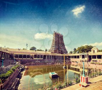 Vintage retro hipster style travel image of Sri Meenakshi Temple water tank, Madurai, Tamil Nadu, India with grunge texture overlaid