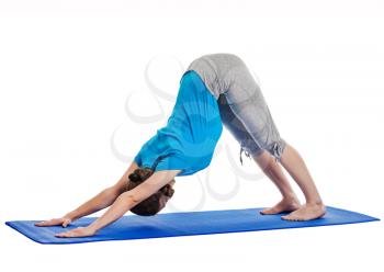 Yoga - young beautiful woman yoga instructor doing Downward Facing Dog (adho mukha svanasana) asana exercise isolated on white background