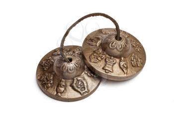 Tibetan Buddhist tingsha cymbals isolated on white
