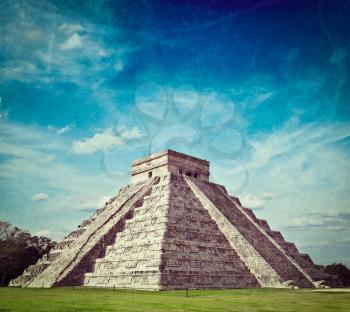 Vintage retro hipster style travel image of travel Mexico background - Anicent Maya mayan pyramid El Castillo (Kukulkan) in Chichen-Itza, Mexico with grunge texture overlaid