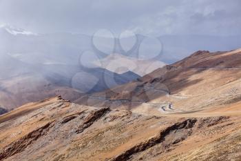 Road in Himalayas in clouds near Tanglang la Pass  - Himalayan mountain pass on the Leh-Manali highway. Ladakh, India