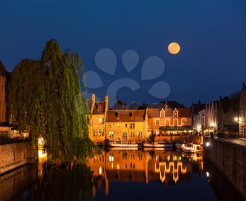 Canal and medieval houses in twilight. Bruges (Brugge), Belgium