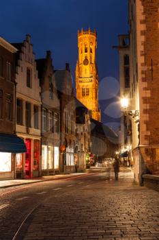 Bruges street in night. Belfry in background. Bruges, Belgium