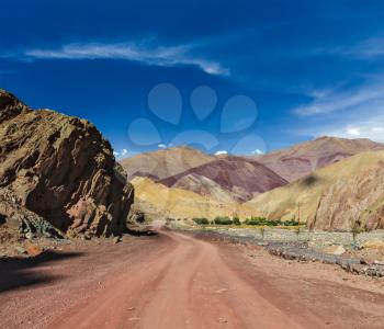 Travel forward concept background - road Himalayas with mountains. Manali-Leh road, Ladakh, Jammu and Kashmir, India