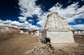 Whitewashed chortens (Tibetan Buddhist stupas). Ladakh, Jammu and Kashmir, India