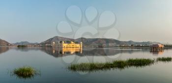 Panorama of Man Sagar Lake and Jal Mahal (Water Palace) on sunset.  Jaipur, Rajasthan, India