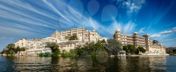 India luxury tourism concept background - panorama of Udaipur City Palace from Lake Pichola. Udaipur, India