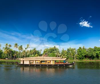 Kerala India travel background - Houseboat on Kerala backwaters. Kerala, India