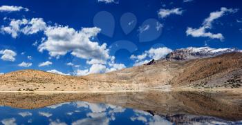 Mountain lake in Himalayas with reflection panorama. Dhankar, Spiti valley, Himachal Pradesh, India