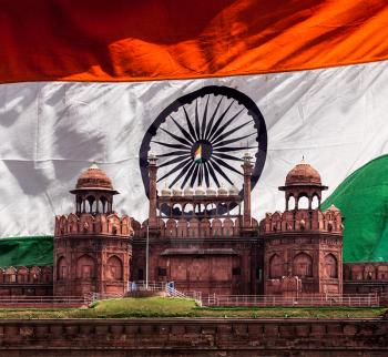 India travel national background - Red Fort (Lal Qila) Delhi against Indian national flag background. Delhi, India