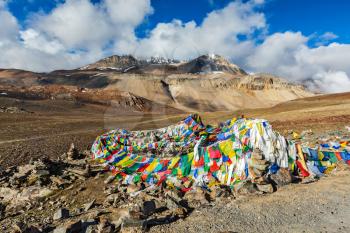 Buddhist prayer flags (lungta) on Baralacha La pass on Manali-Leh highway in Himalayas. Himachal Pradesh, India