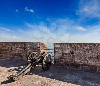 Old canon in Mehrangarh Fort overlooking city, Jodhpur, Rajasthan, India