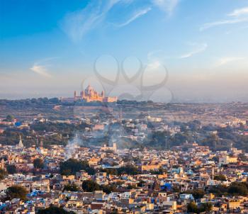 Aerial view of Jodhpur - the Blue city - with Umaid Bhawan Palace on sunset. View from Mehrangarh Fort.  Jodphur, Rajasthan, India