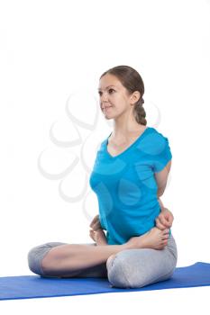 Yoga - young beautiful woman  yoga instructor doing bound lotus pose (Baddha Padmasana) exercise isolated on white background