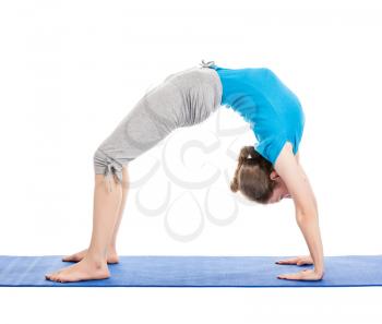 Yoga - young beautiful slender woman yoga instructor doing Upward Bow Pose (intense backbend) (urdhva dhanurasana) asana exercise isolated on white background