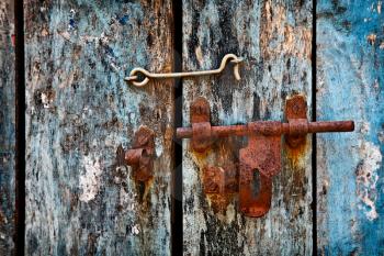 Old rusty latch on the door