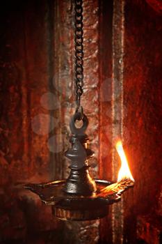 Burning lampion with oil in Hindu temple