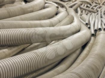 Various flexible metal hose in a warehouse.