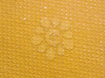 Rubbed yellow ochre paper texture as background.