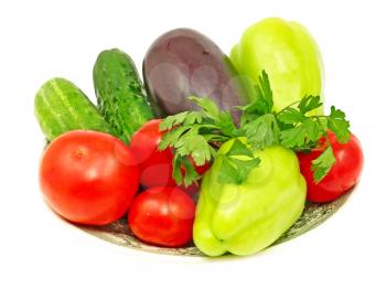 Plate with fresh vegetables isolated on white background.