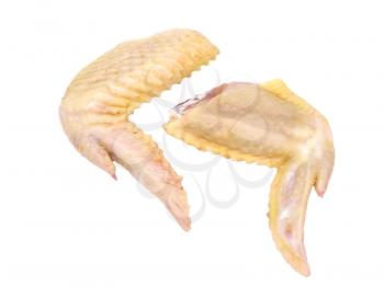 Two uncooked chicken wings isolated on white background.