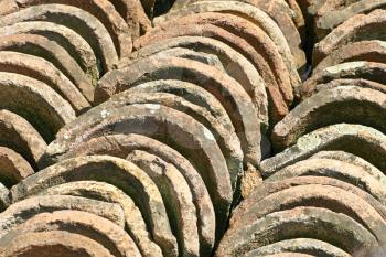 Piles of old ceramic tiles taken closeup suitable as background.
